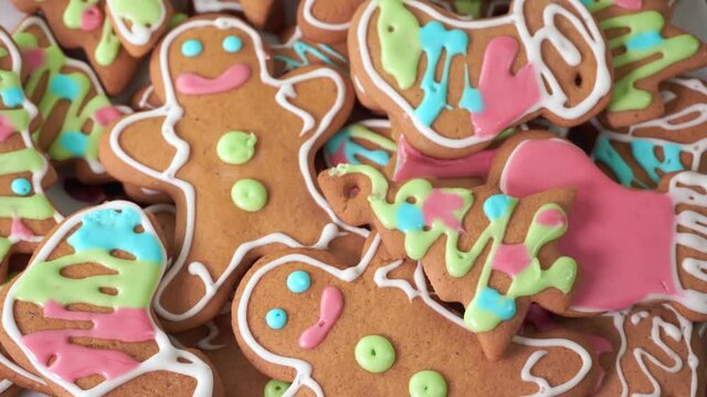 Christmas gingerbread cookies decorated with colored sugar icing, close-up.