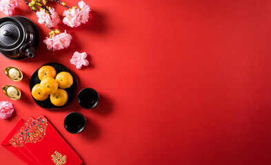 Chinese new year festival decorations pow or red packet, orange and gold ingots or golden lump on a...