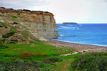 Rock against the background of the blue sea and waves in cyprus