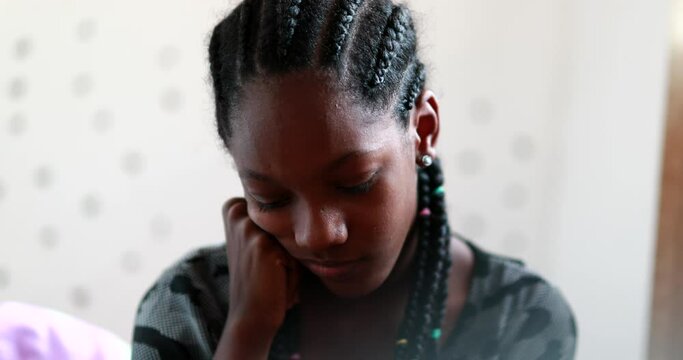 Pensive black teen girl. Thoughtful African american adolescent teenager in dilemma