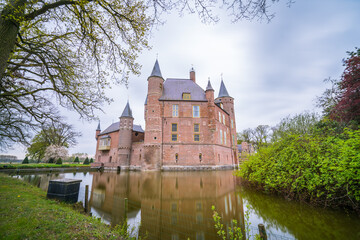 Fototapeta na wymiar An ancient Dutch castle reflected in the pond