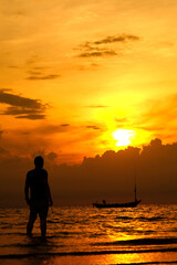 silhouette of a person on the beach