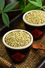 Buckwheat rice on the background of retro Chinese style.The Chinese meaning in the picture is happiness