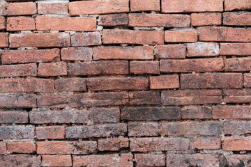 Old brick wall. Horizontal wide brick wall background. Vintage house facade.
