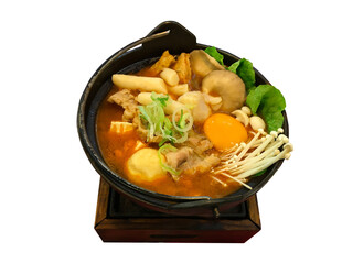 Spicy kimchi soup with topokki, mushroom, eeg, tofu, sliced pork and fish ball served in hot pot isolate on white background texture, Clipping path.