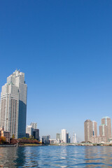 Fototapeta na wymiar High-rise buildings against blue sky in Tokyo