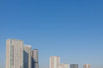 Fototapeta na wymiar Modern high rise buildings against the blue sky