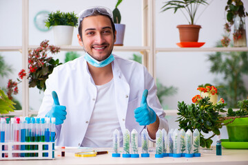 Young male chemist perfumer working in the lab