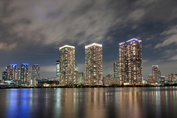 Fototapeta na wymiar Illuminated high rise residential buildings in the night