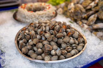 Raw blood cockles on ice