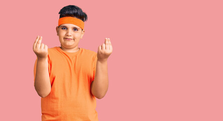 Little boy kid wearing sportswear doing money gesture with hands, asking for salary payment, millionaire business