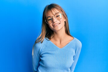 Obraz premium Teenager caucasian girl wearing casual clothes and glasses with a happy and cool smile on face. lucky person.