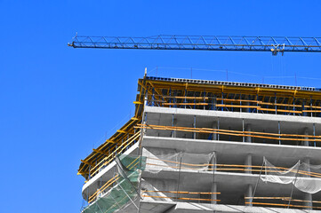 Crane and highrise construction site