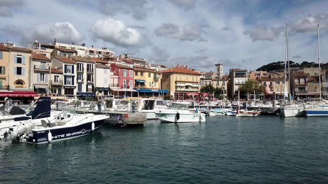 Port the Cassis barbor with boats and buildings on a blue sky day