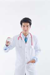 Young Asian doctor showing card