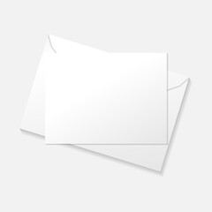 White greeting card on envelope flat lay top view mockup template. Isolated on white background with shadow.