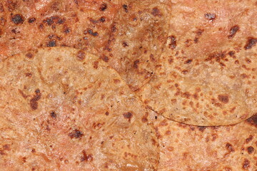 Traditional paratha - Macro closeup with selective focus of homemade oily bread