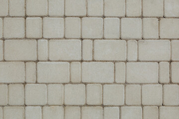 Obraz premium Concrete or cobble gray square pavement slabs or stones for floor, wall or path.