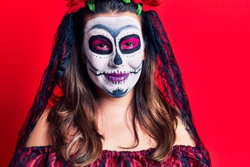 Young woman wearing day of the dead costume over red with a happy and cool smile on face. lucky person.