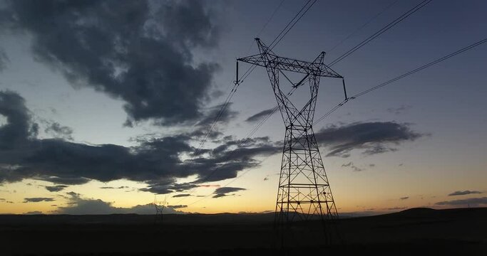 Transmission Tower front of a Beautiful Sunset Landscape