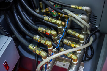 Part of automatic injection molding machine and flexible plastic hoses at exhibition, trade show....