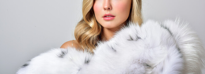 Beautiful girl in a fur coat. Beauty Fashion Model Girl. Luxury Winter Woman.