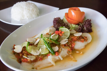 Steamed Thai dory fish with lime, chili and garlic served with steamed rice