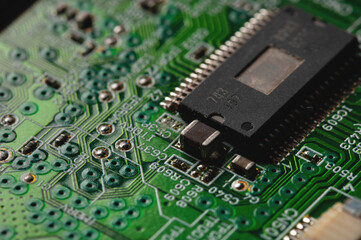 Close-up of computer chip on green pc motherboard microchip