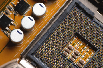 Blank cpu cpu socket with pins on motherboard in yellow color close-up