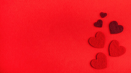Flatlay red hearts on a red background. Concept of Valentine's day, wedding. Copy space.