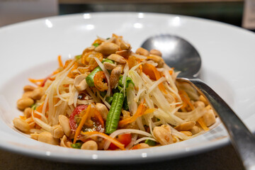 Thai spicy papaya salad with dried shrimps called Som Tam