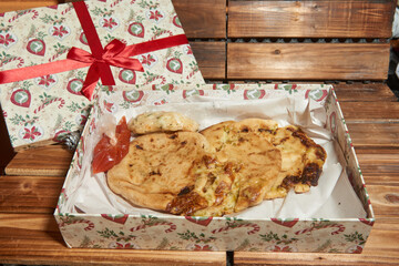 Close up photo of pupusas dish in a gift box, a traditional meal from El Salvador	