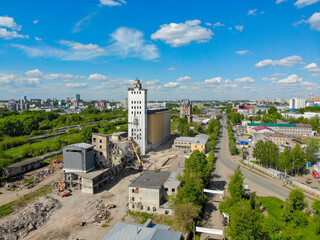 Aerial view of the destruction of a grain elevator by construction equipment (Kirov, Russia)