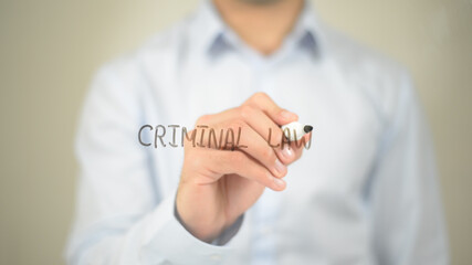 Criminal Law, man writing on transparent screen