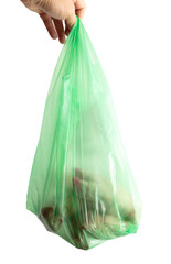 Green package with meat in hand isolated on white