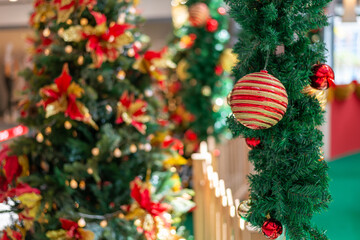 Selective focus christmas ball hanging at green grass