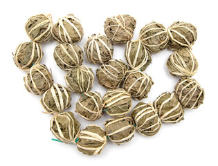 Close up of balls of dried tea leaves