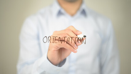 Orientation , man writing on transparent screen