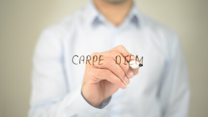 Carpe Diem, man writing on transparent screen