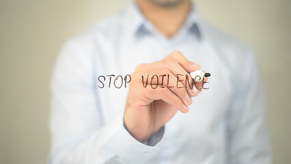 Stop Violence, man writing on transparent screen