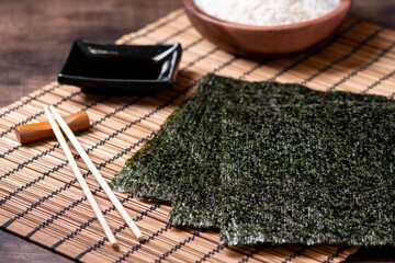 Nori leaves. Crunchy dried seaweed. Japanese traditional cuisine © Liudmila Zavialova