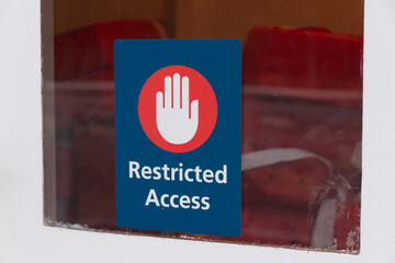 View of red sign "Restricted access" on a ferry in Vancouver