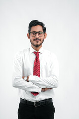 Young indian successful business man or executive wearing spectacles over white background