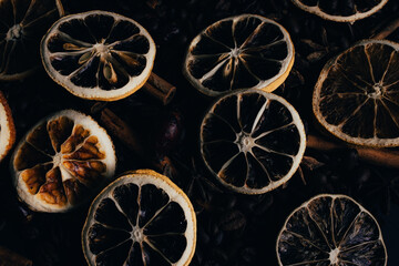 Fototapeta na wymiar Coffe background with dried oranges and cinnamon