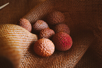 Whole lychee fruit on linen background