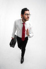 Young indian business man stepping up for success over a white background
