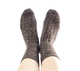 Wool socks on the foot. Close up. Isolated on a white background