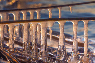 Background of icicles in the sunset light