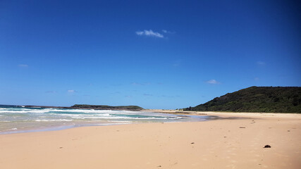 Fototapeta na wymiar Moonee Beach Near Catherine Hill Bay New South Wales Australia, with Ocean Waves crashing over the rocks