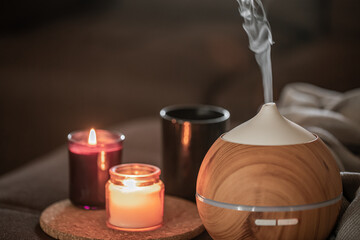 Modern oil aroma diffuser wiht decor details copy space.